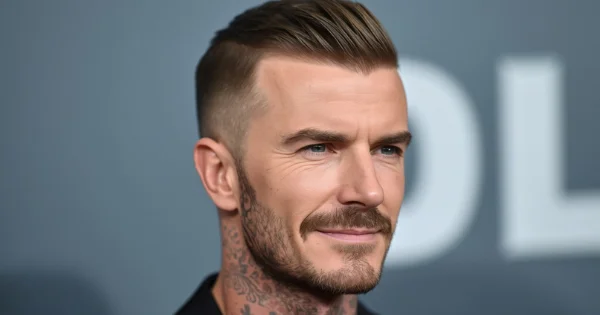 David Beckham buzz cut hairstyle, short fade on sides with textured top and beard, stylish David Beckham haircut inspiration