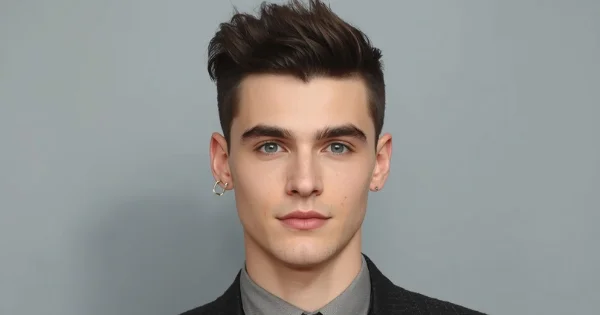 Timothée Chalamet with Timothée Chalamet-inspired buzz cut, short faded sides and textured top, clean modern hairstyle on neutral background